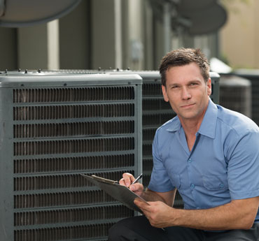 Air Conditioning Repairman With Clipboard