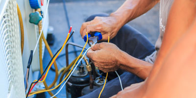 Technician Preparing to Install a New Air Conditioner